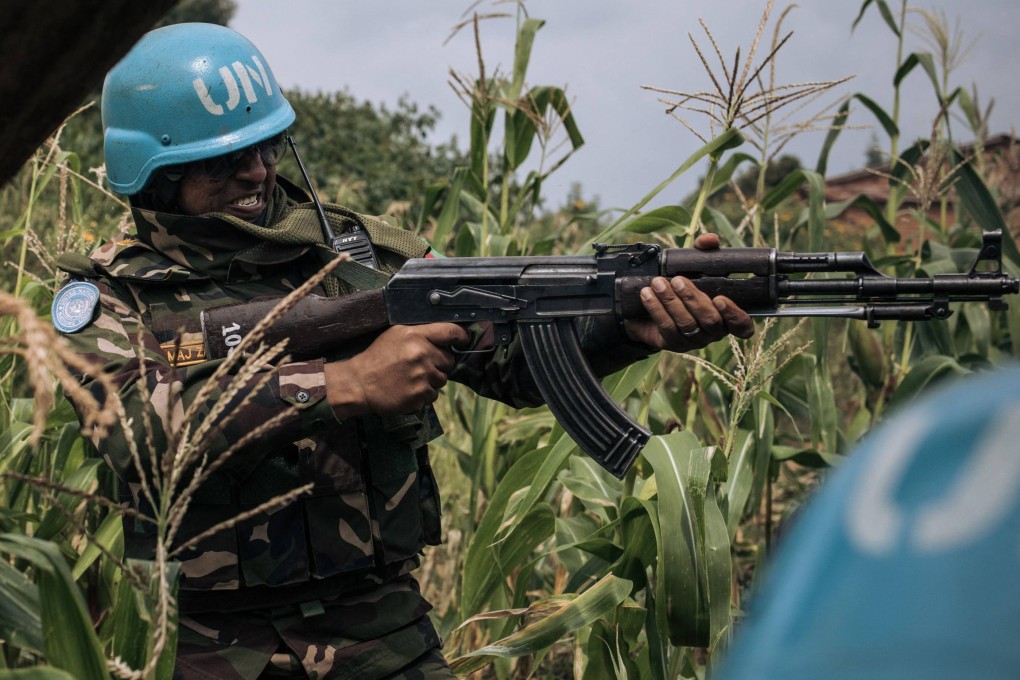 A Bangladeshi soldier of the United Nations Mission in DR Congo, Monusco, shoots at Codeco militiamen to repel them as they launch an attack on a Red Cross team in December. File photo: AFP