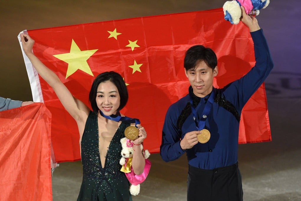 Gold medalists Sui Wenjing and Han Cong of China pose during the medal ceremony for the pairs free skating at the ISU Four Continents Figure Skating Championships in Seoul, on February 8, 2020. Photo: Jung Yeon-je/AFP