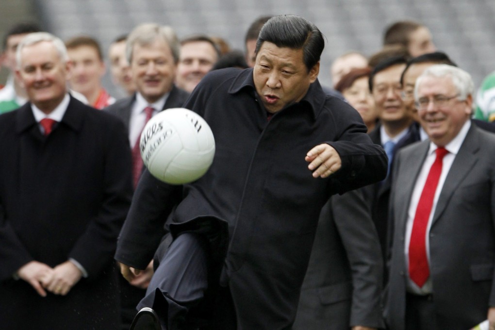 Xi Jinping kicks a Gaelic football during a 2012 visit to Croke Park in Dublin. Photo: Reuters