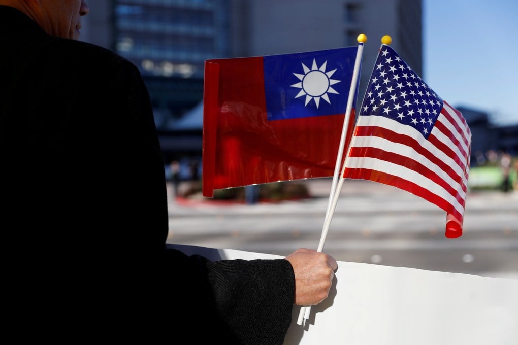 A demonstrator holds Taiwan and US flags in Burlingame, California, in January 2017. Photo: Reuters