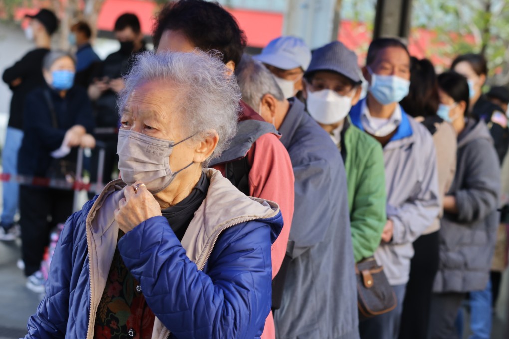 Senior citizens queue up to get vaccinated at Wong Tai Sin Temple Square on January 8. The government should consider the holistic needs of older Hongkongers before implementing policies like the health care voucher scheme for the elderly. Photo: Dickson Lee
