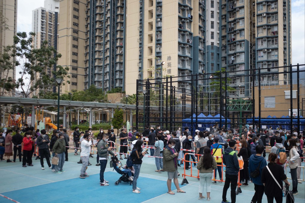 Residents wait in line at a makeshift Covid-19 testing station at the Kwai Chung Estate on January 23. Photo: Bloomberg