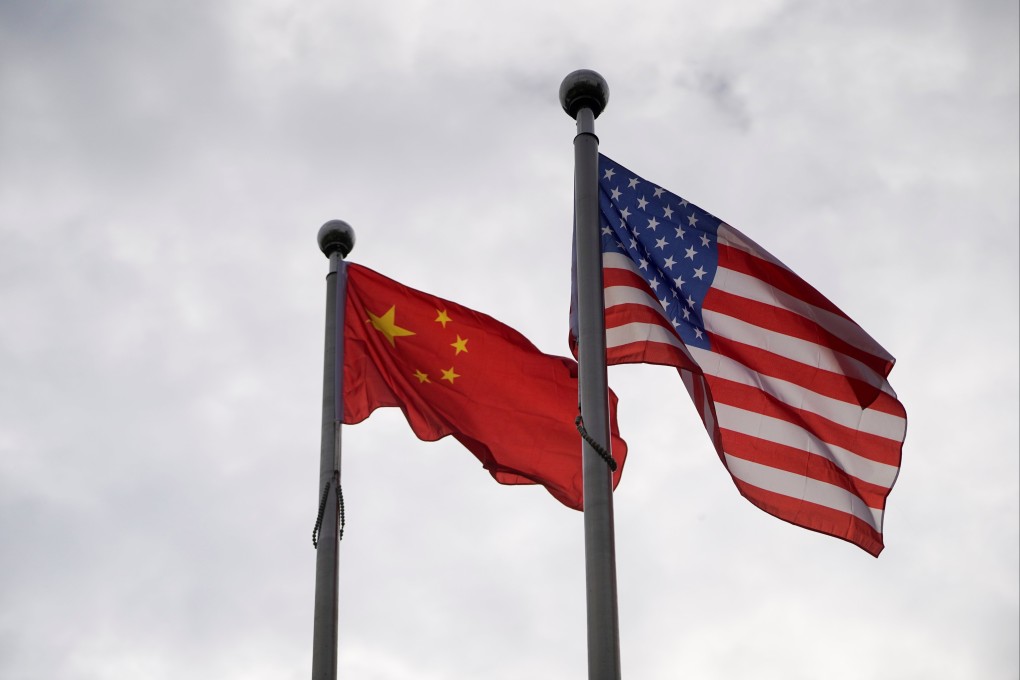 Chinese and American flags above a building in Shanghai, November 16, 2021. Photo: Reuters