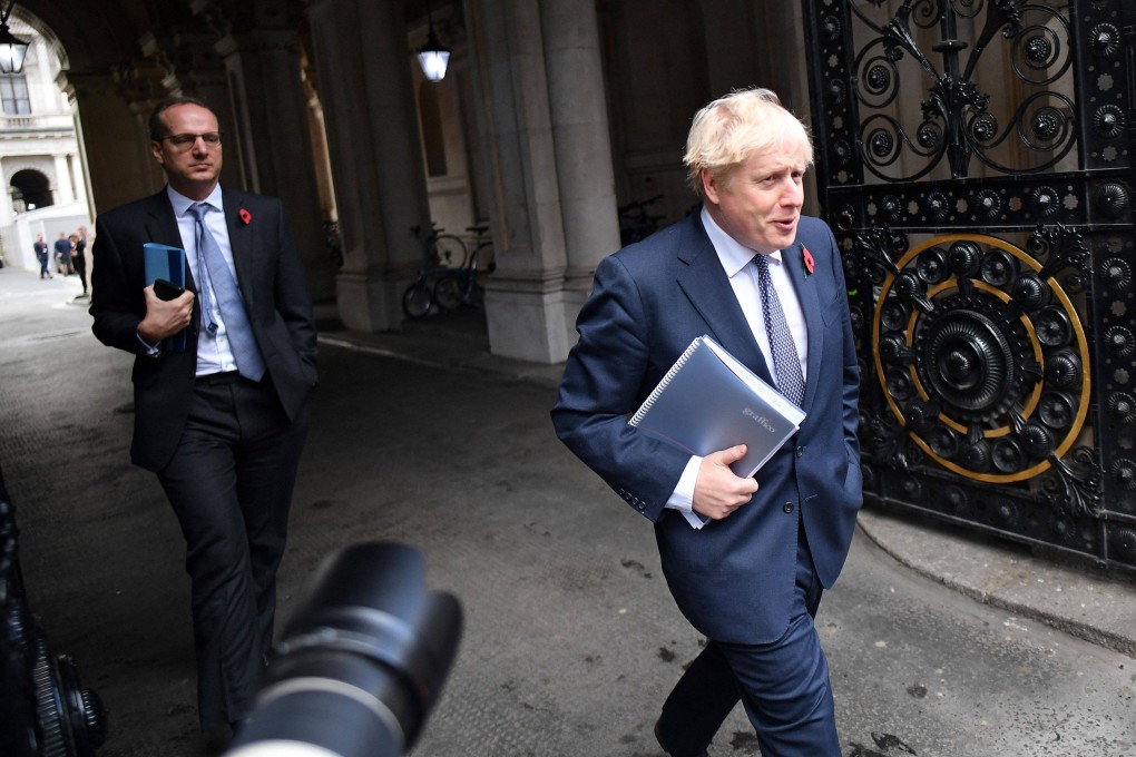 Britain’s Prime Minister Boris Johnson (right) and Martin Reynolds, the Prime Minister’s Principal Private Secretary, arrive back at Downing Street in November 2020. Photo: AFP