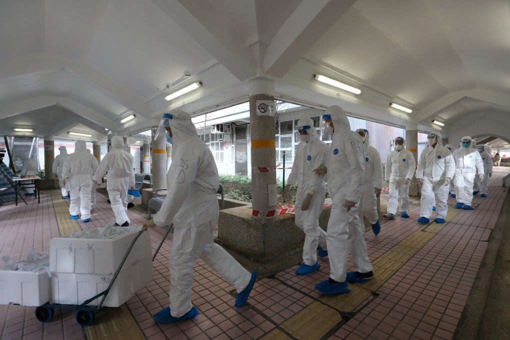 Health workers are deployed at Kwai Chung Estate on January 26 during a five-day lockdown for residents who had to undergo daily testing and stay at home. Photo: Jelly Tse
