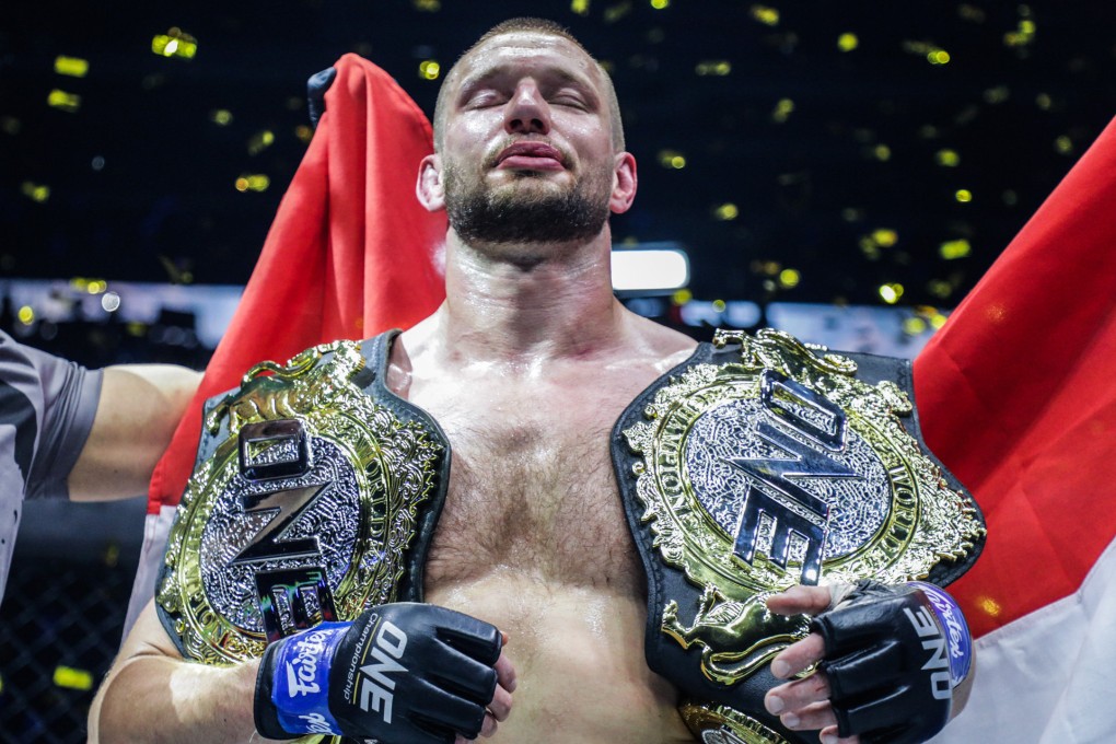 Reinier de Ridder celebrates wiht his two world titles. Photos: ONE Championship.
