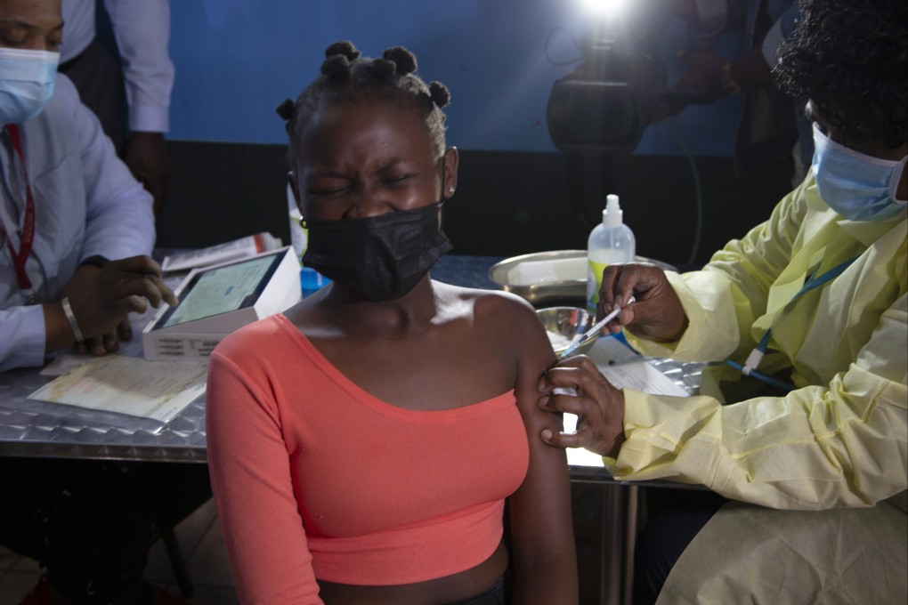 Washington can bolster its soft power by exporting more of its effective Covid-19 vaccines, health experts say. Pictured, a young woman receives a Pfizer vaccine in South Africa. Photo: AP