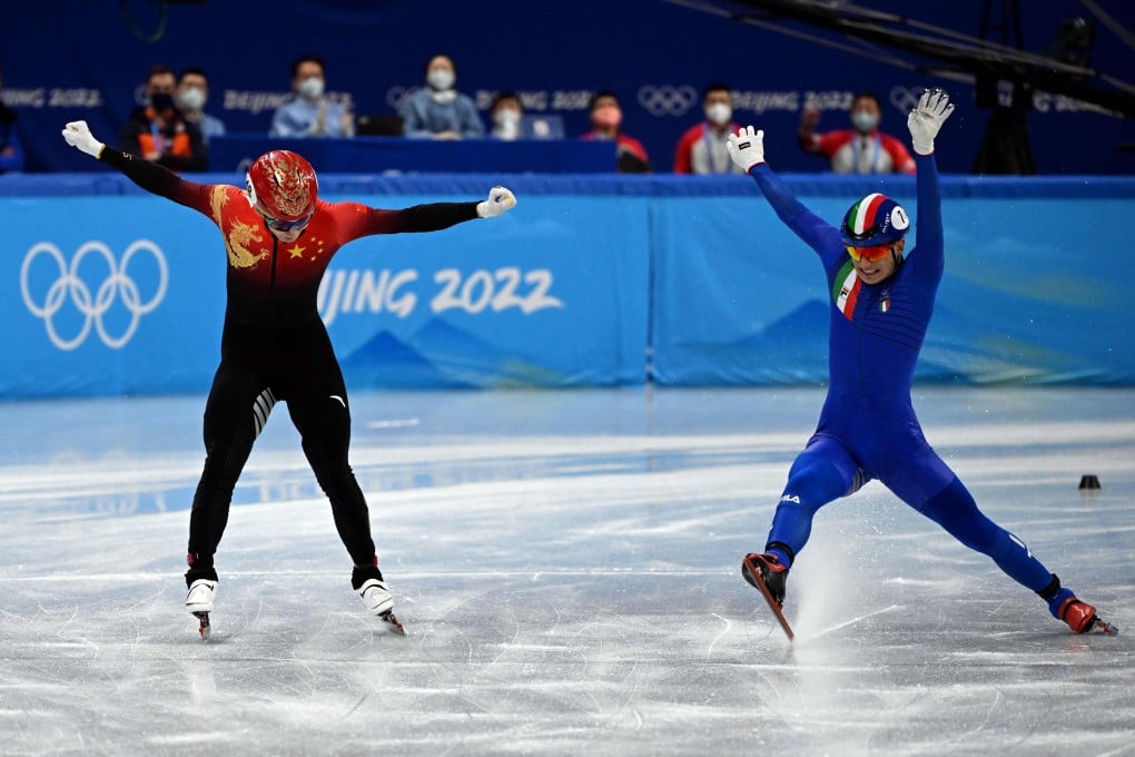 China’s Wu Dajing celebrates after helping his team win gold in the short track speedskating mixed relay event in Beijing. Photo: AFP