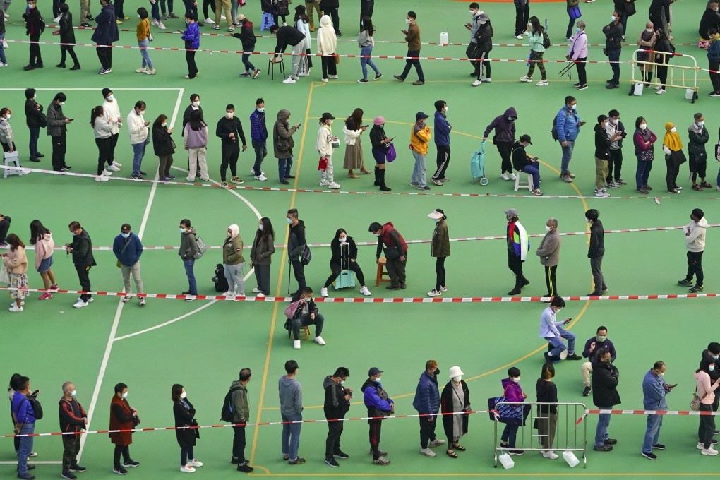 Residents wait to be tested for Covid-19 at On Hing Playground in Yuen Long on Sunday. Photo: Felix Wong