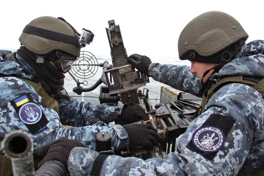 Members of Ukraine’s navy fire a gun during drills held in the Black Sea last month. Photo: Ukrainian Naval Forces Handout via Reuters