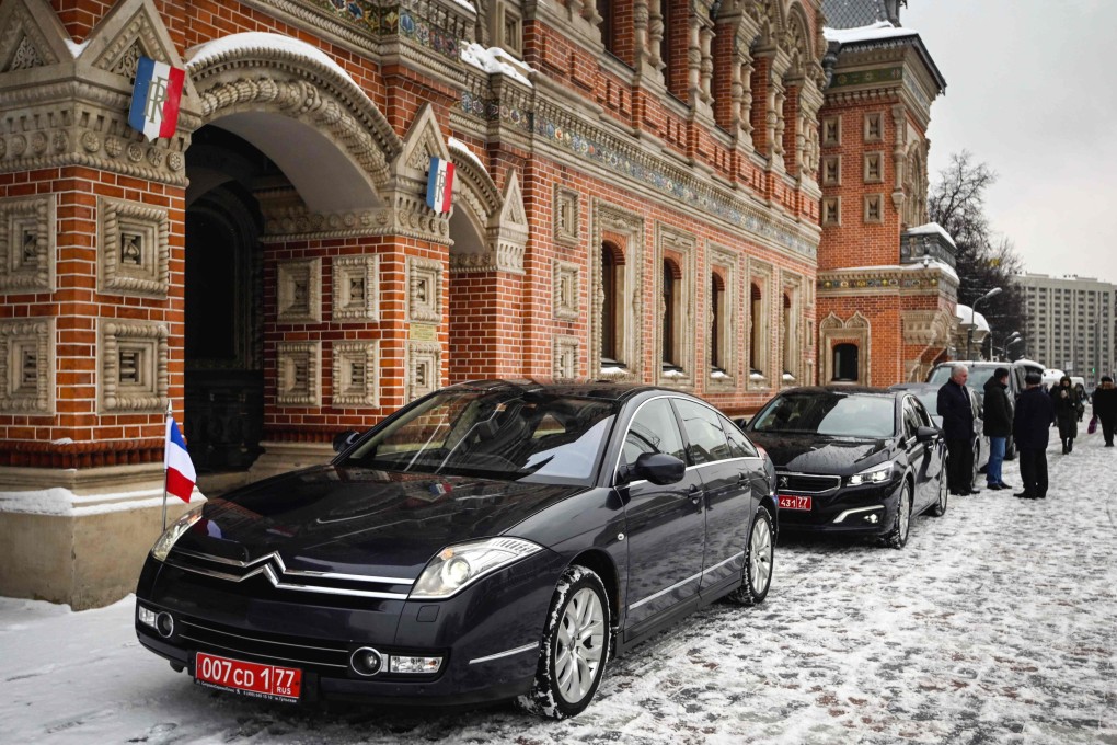 Diplomatic cars in front of the residence of the French ambassador in Moscow on Monday, prior to the visit of French President Emmanuel Macron to meet his Russian counterpart Vladimir Putin. The Kremlin said a meeting of the leaders was important in resolving tensions over Ukraine, but significant breakthroughs could not be expected. Photo: AFP