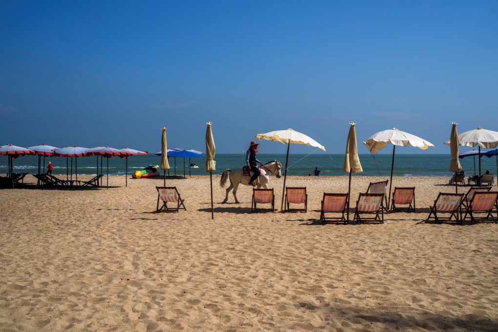 A man rides a horse at Cha-Am Beach in Phetchaburi province, Thailand. Photo: Reuters