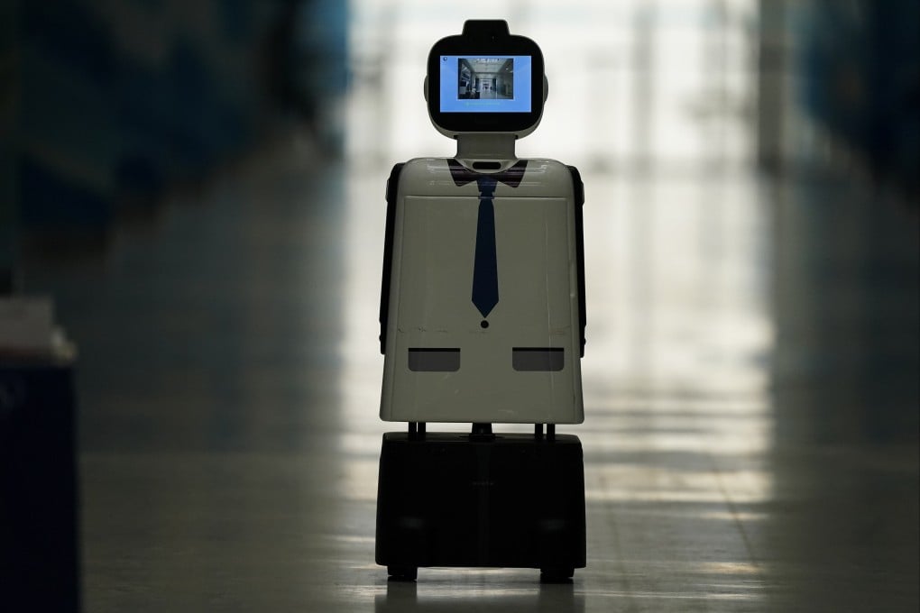 A robot wanders the hall of the curling venue at the Beijing Winter Olympics. Photo: AP