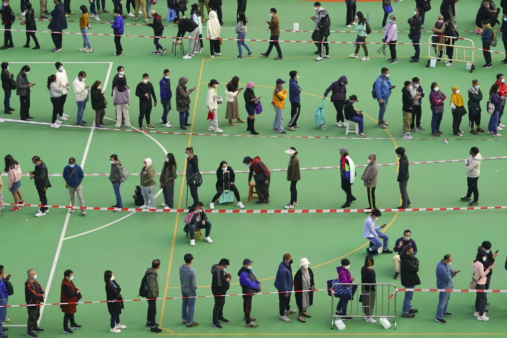 People in a long queue for Covid-19 testing at On Hing Playground in Yuen Long on February 6. Hongkongers should not have to be paid to do their moral duty and get tested. Photo: Felix Wong