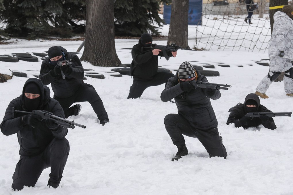 Ukrainians attend military training for civilians in Kyiv on February 6. According to a survey conducted by the Kyiv International Institute of Sociology, 50.2 per cent of Ukrainians said they would resist in case of Russian military intervention into their city, town or village. Photo: EPA-EFE