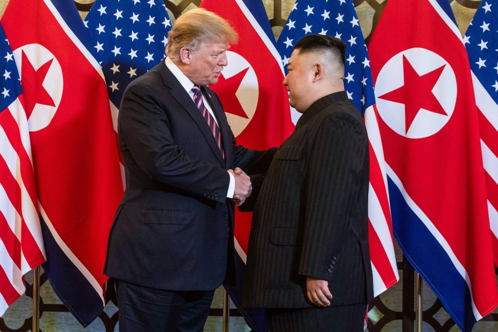 US President Donald Trump shakes hands with North Korea’s leader Kim Jong-un in Hanoi in February 2019. Photo: AFP