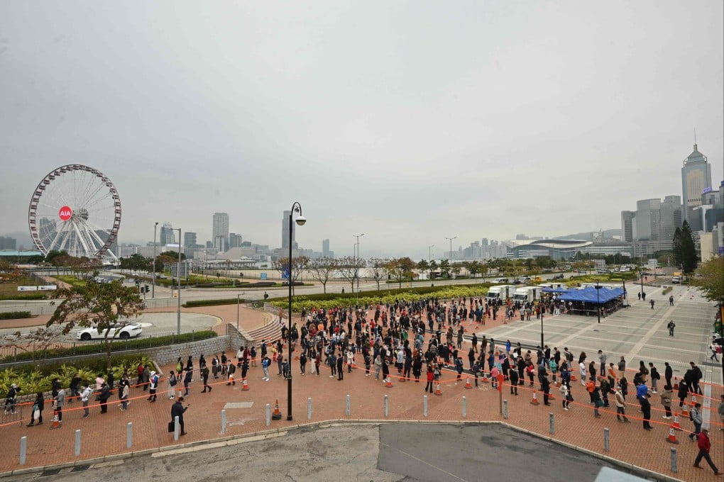 People queue at a mobile specimen collection station for Covid-19 testing in Hong Kong’s Central district on February 7. Photo: AFP