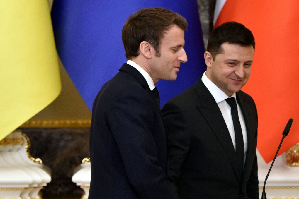 Ukrainian President Volodymyr Zelensky (R) and French President Emmanuel Macron leave after a press conference following their meeting in Kyiv on February 8, 2022. Photo: AFP