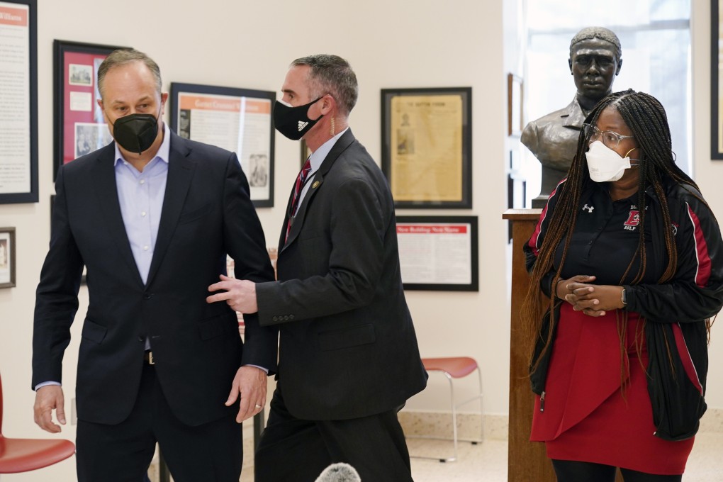 Doug Emhoff, the husband of US Vice-President Kamala Harris, is whisked out of an event at a high school by a Secret Service agent on Tuesday. Photo: AP