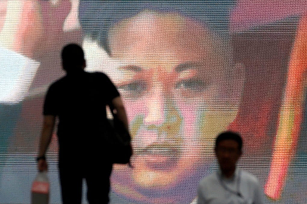 North Korean leader Kim Jong-un appears on a screen in Tokyo, Japan during a news report on Pyongyang’s ICMB test in July 2017. Photo: Reuters