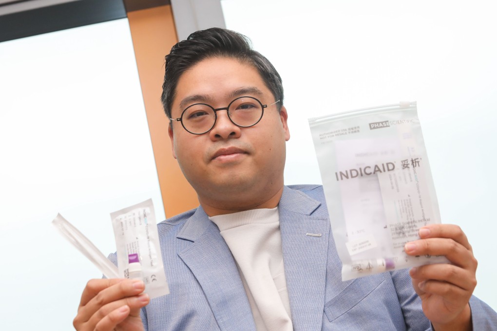 Ricky Chiu Yin-to, CEO and founder of Phase Scientific International, holds  rapid test kits developed by the company to detect coronavirus. Photo: Jelly Tse