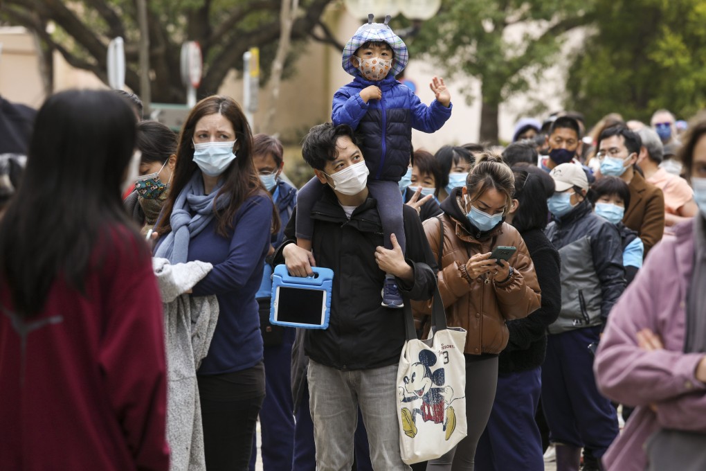 Residents queue up to receive a Covid-19 test at a mobile specimen collection station in Discovery Bay. Photo: Yik Yeung-man