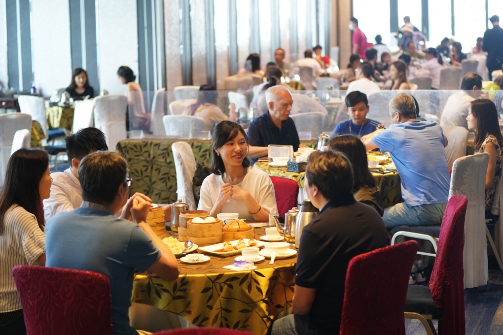 Diners at a Tsim Sha Tsui restaurant. From Thursday, just two people will again be allowed together in public or to dine at each table in restaurants. Photo: Sam Tsang