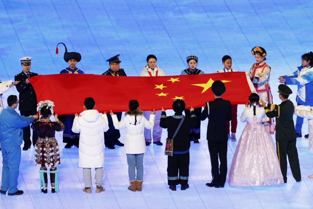 The dress featured in the ceremony during a segment in which China’s ethnic groups carried the national flag. Photo: Kyodo