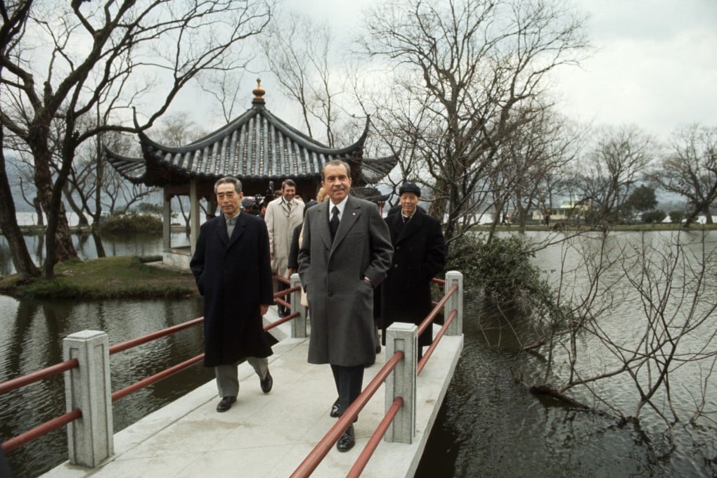 US president Richard Nixon is accompanied by Chinese premier Zhou Enlai and other Chinese officials as he takes a walk during his trip to China. Photo: Corbis/Getty Images