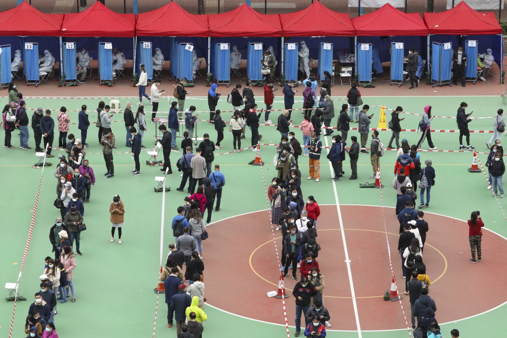 Local residents and workers queue up for Covid-19 testing at a mobile specimen collection station in Yuen Long. Photo: Jelly Tse