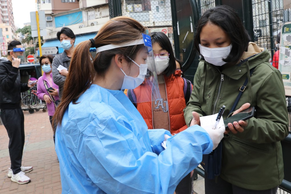 Residents and workers subject to compulsory testing queue up at a mobile specimen collection station in Yuen Long on Thursday. Photo: Jelly Tse