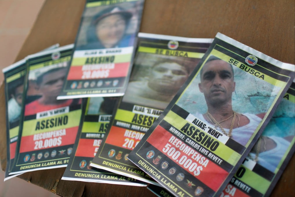 Wanted posters for members of El Koki’s criminal gang are seen in Caracas, Venezuela in July. Photo: Reuters