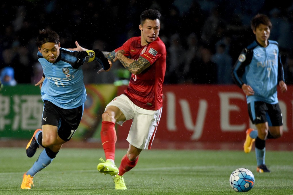 Defender Zhang Linpeng (centre), pictured on April 12, 2017, is known for his many tattoos, but new rules in China mean he may have to remove them. Photo: AFP