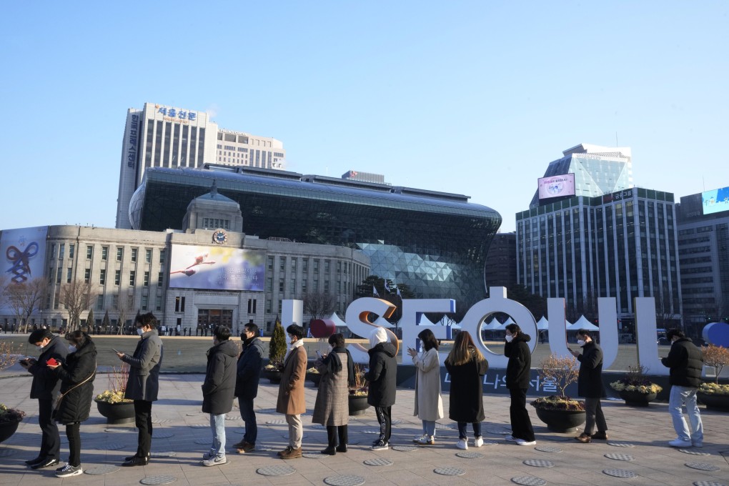 People wait outside a Covid-19 testing centre in Seoul, South Korea, on Thursday. Photo: AP