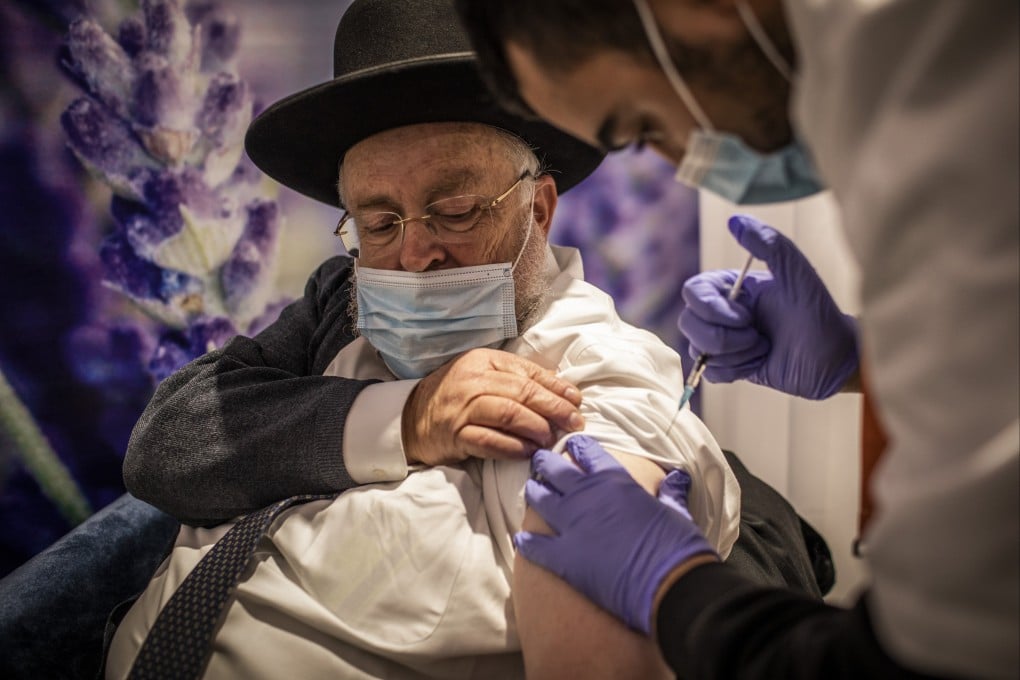 A man receives a dose of the Pfizer-BioNTech Covid-19 vaccine at a vaccination centre in Jerusalem on January 11, 2021, as a part of a nationwide campaign. By mid-January half a million Israelis had received their fourth dose of vaccination against the coronavirus. Photo: DPA