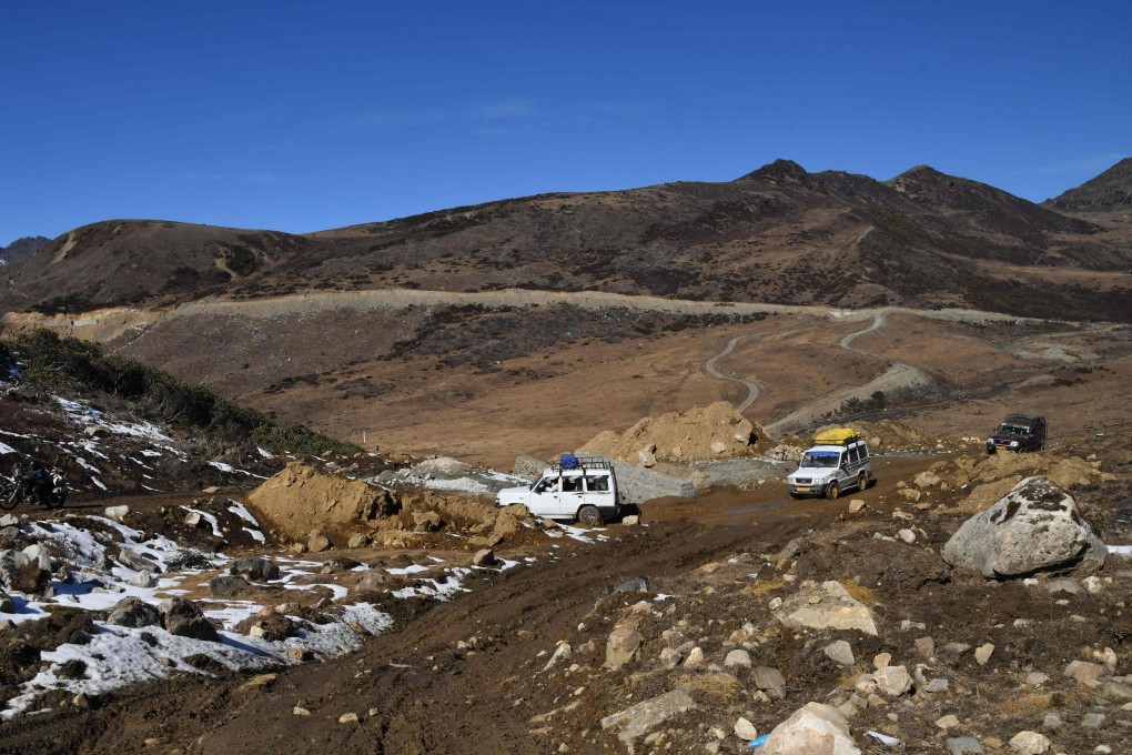 Tourists drive along a road in 2021 on their way to Chumi Gyatse Falls in the Himalayan region that India calls the state of Arunachal Pradesh, much of which is also claimed by China. Photo: AFP