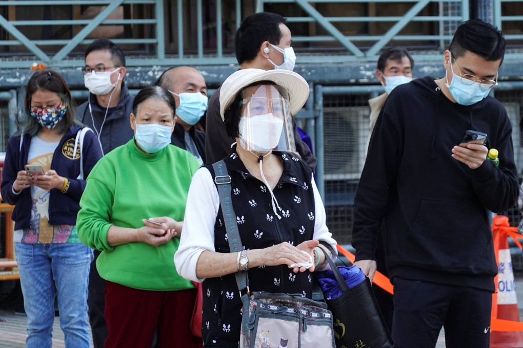 People line up at a makeshift Covid-19 testing site in Hong Kong on Friday. Photo: Reuters