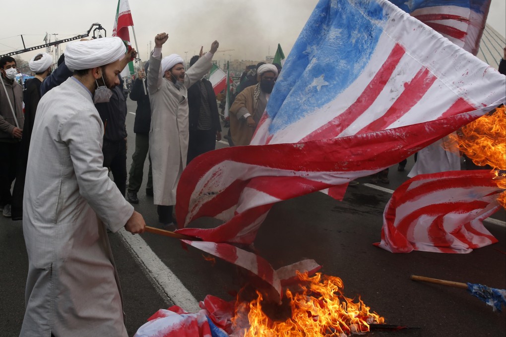 Clerics burn representations of the US flag during the annual rally commemorating the anniversary of Iran’s 1979 Islamic Revolution in Azadi Square in Tehran, Iran, on Friday. Photo: AP