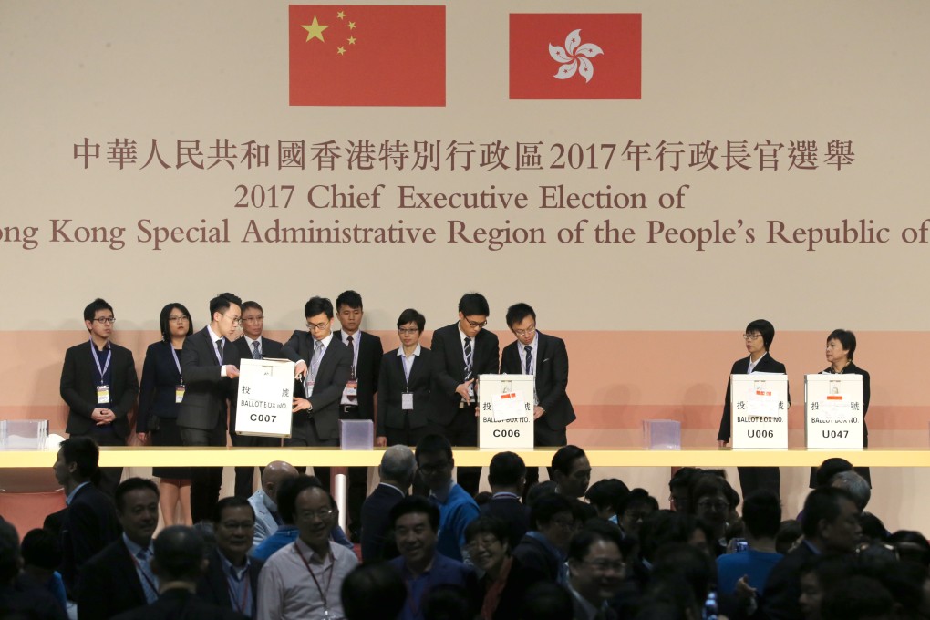 Electoral Affairs Commission staff move ballot boxes onto the stage for the 2017 election. Photo: Sam Tsang