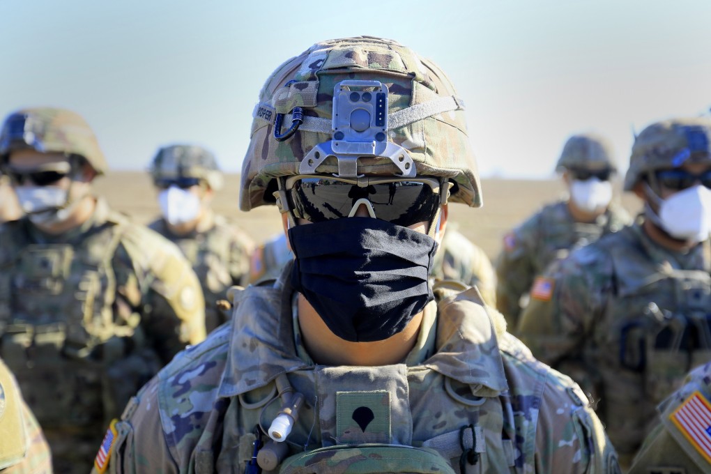An American soldier stands in formation at a military base in Romania on Friday. In addition to the US troops deploying to Poland, about 1,000 US soldiers based in Germany are shifting to Romania. Photo: EPA-EFE