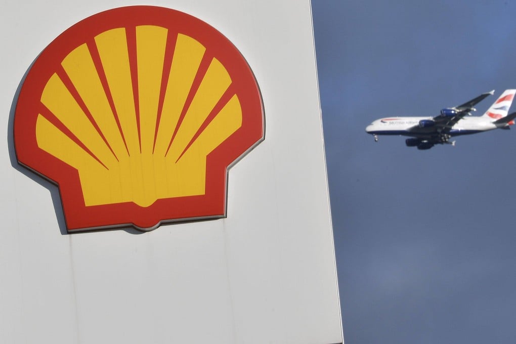 A Shell logo at a fuel station with a plane behind. Photo: Reuters