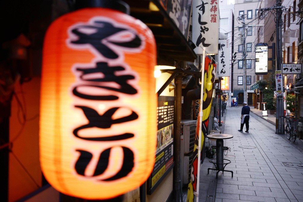 A street lined with bars and restaurants in Japan’s Fukuoka is deserted as Covid-19 curbs remain in place. Photo: Kyodo