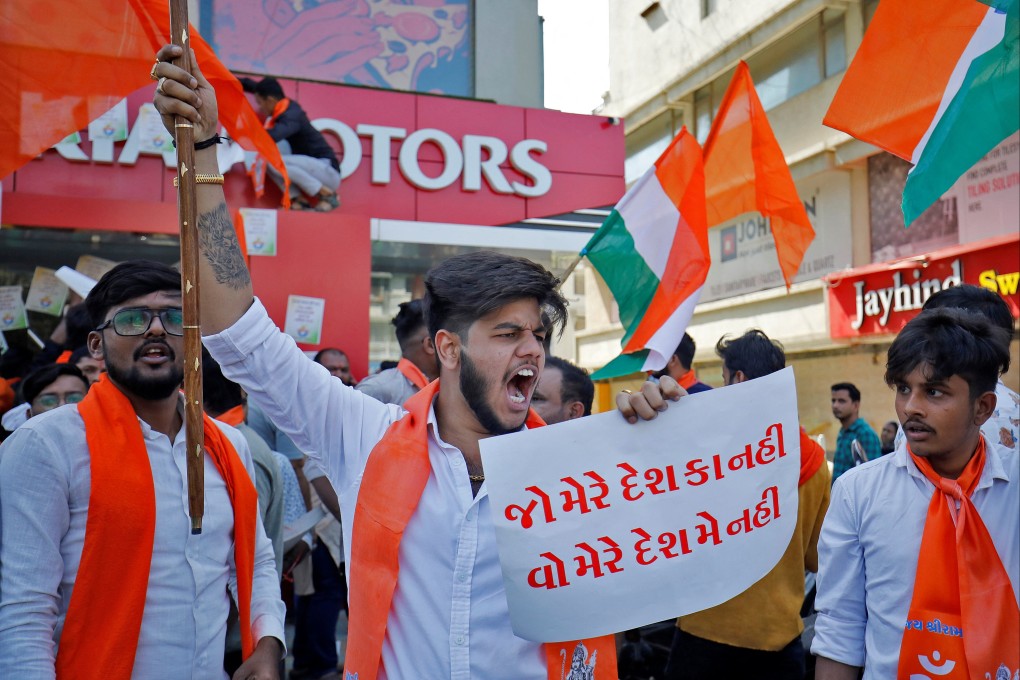 A Hindu activist outside KIA Motors showroom in Gujarat. Photo: Reuters