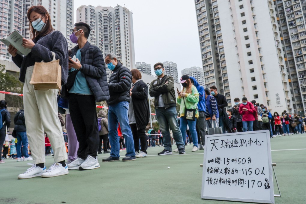 Local residents and workers queue up for mandatory Covid-19 testing in Tin Shui Wai. Photo: May Tse