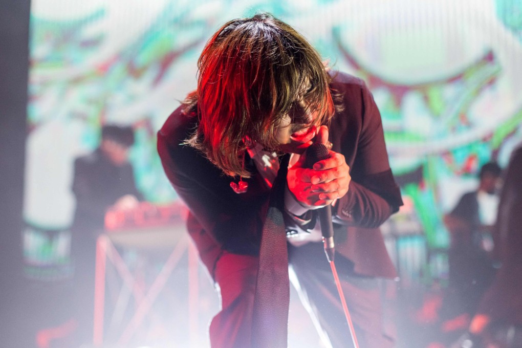 Poom ‘Jay’ Euarchukiati of Defying Decay performs during a concert in Bangkok. Photo: AFP