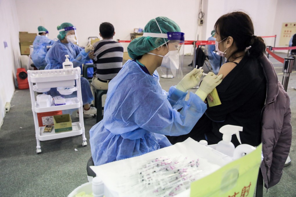 People get booster shots at a vaccination site in Taipei. About 30 per cent of Taiwan’s 23.5 million people have now had a booster and that figure is gradually rising. Photo: Bloomberg