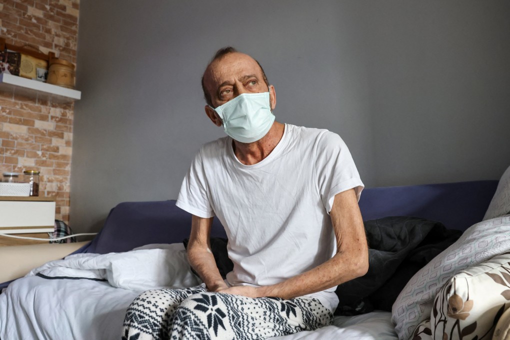 Muzaffer Kayasan, who has tested positive for Covid-19 78 times, rests at home in Istanbul on Thursday. Photo: Reuters