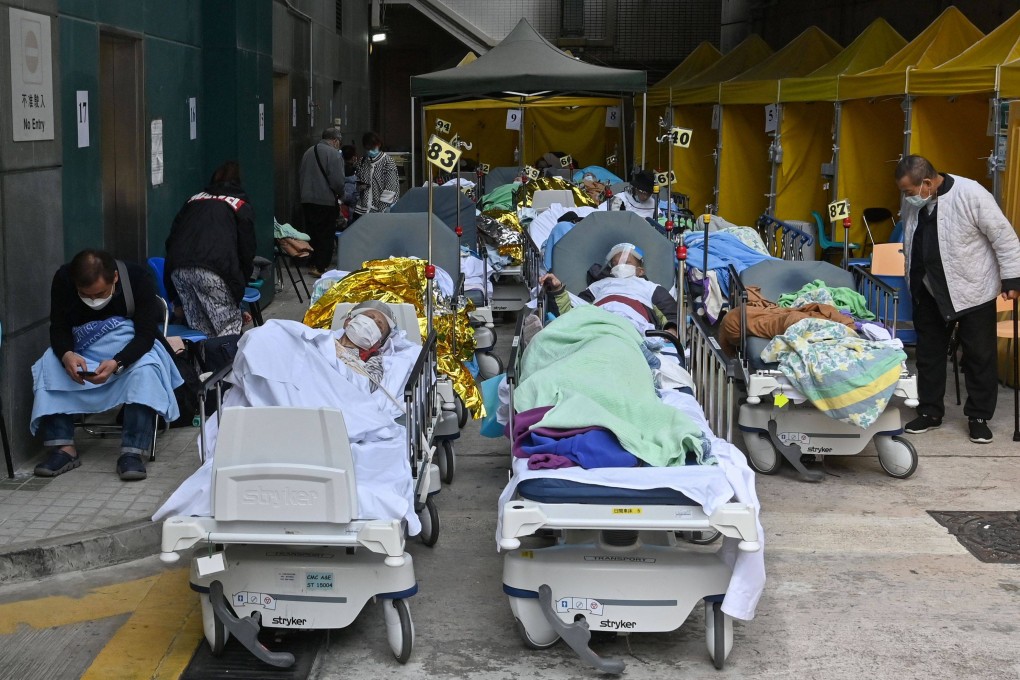 People lie in hospital beds outside Caritas Medical Centre in Hong Kong on February 15, as the city faces its worst wave of coronavirus to date. Photo: AFP