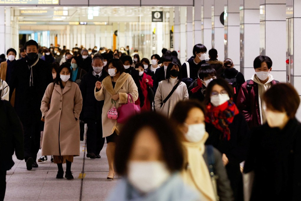 Commuters at a train station concourse in Tokyo. Photo: Reuters