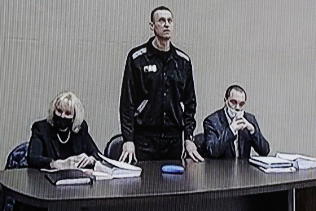 Russian opposition leader Alexei Navalny (centre) is seen on a monitor screen during an offsite court session in the penal colony N2 (IK-2) in Pokrov, Russia on Tuesday. Photo: EPA-EFE